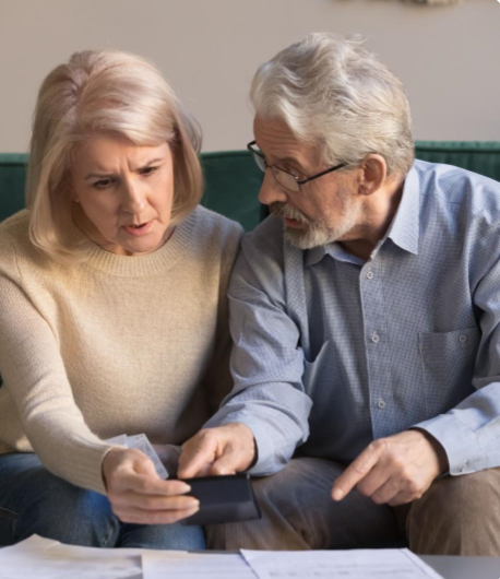Senior couple reviewing information together